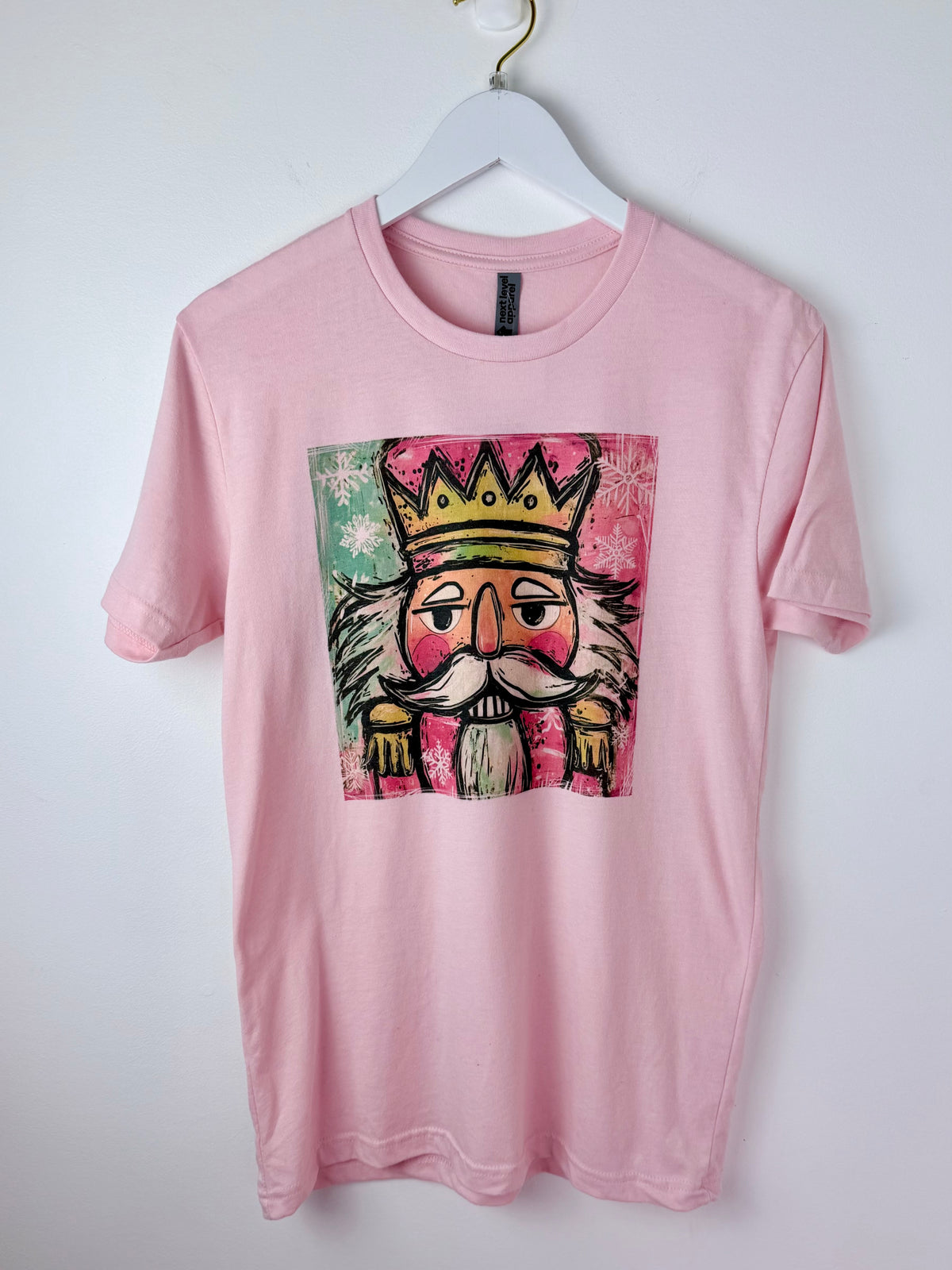 Nutcracker Pop — Soft Pink Colorful Christmas Graphic Tee