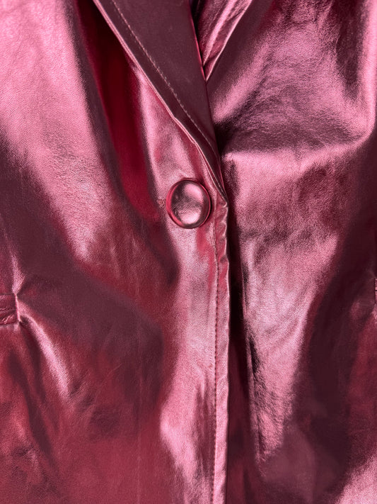 Close-up of a shiny pink single button glam metallic blazer