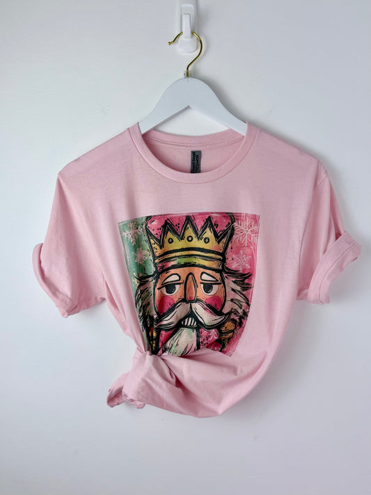 Nutcracker Pop — Soft Pink Colorful Christmas Graphic Tee
