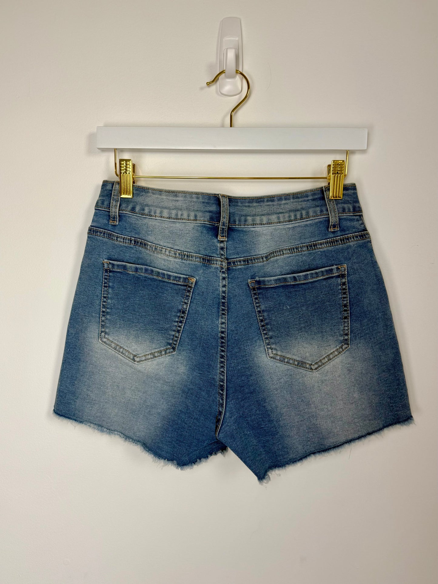 High-rise pearled denim shorts