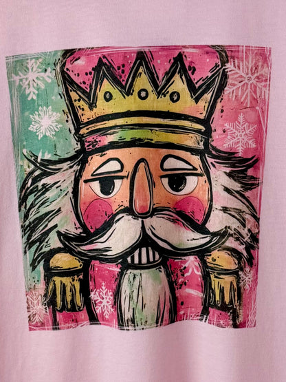Nutcracker Pop — Soft Pink Colorful Christmas Graphic Tee