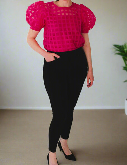 Checkmate sheer puff sleeve top On woman wearing black pants