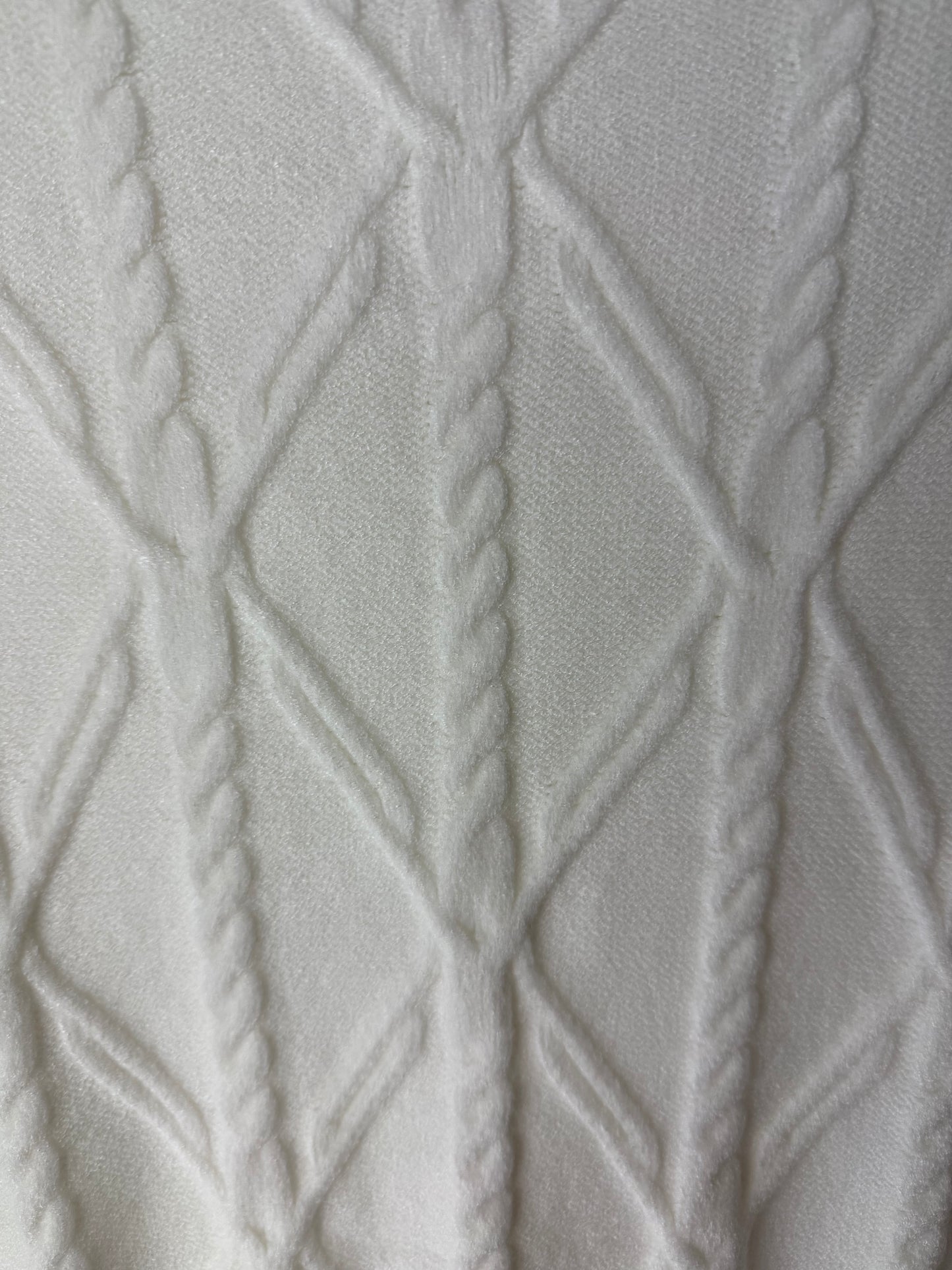 Close-up of textured gray fabric with diamond pattern