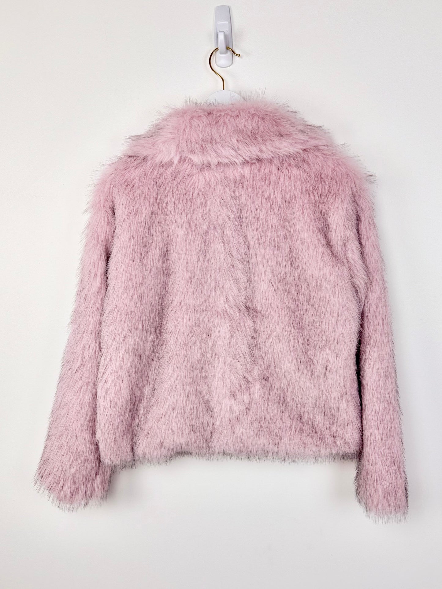 Pink fluffy jacket on a white background