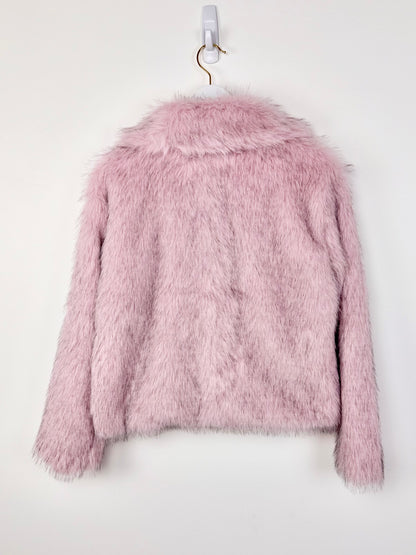 Pink fluffy jacket on a white background