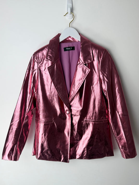 Edgy glam Pink metallic jacket on a hanger against a white background