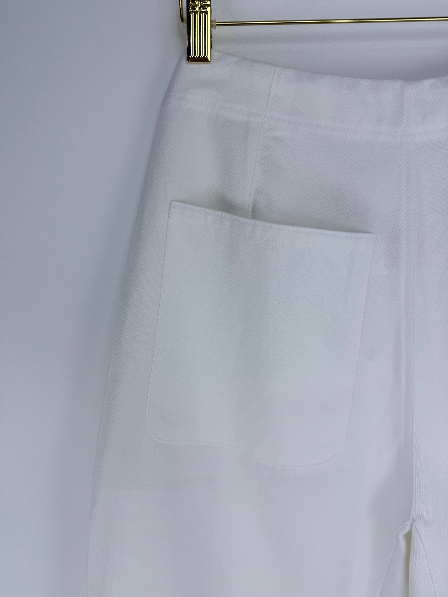 White pants with a pocket on a white background