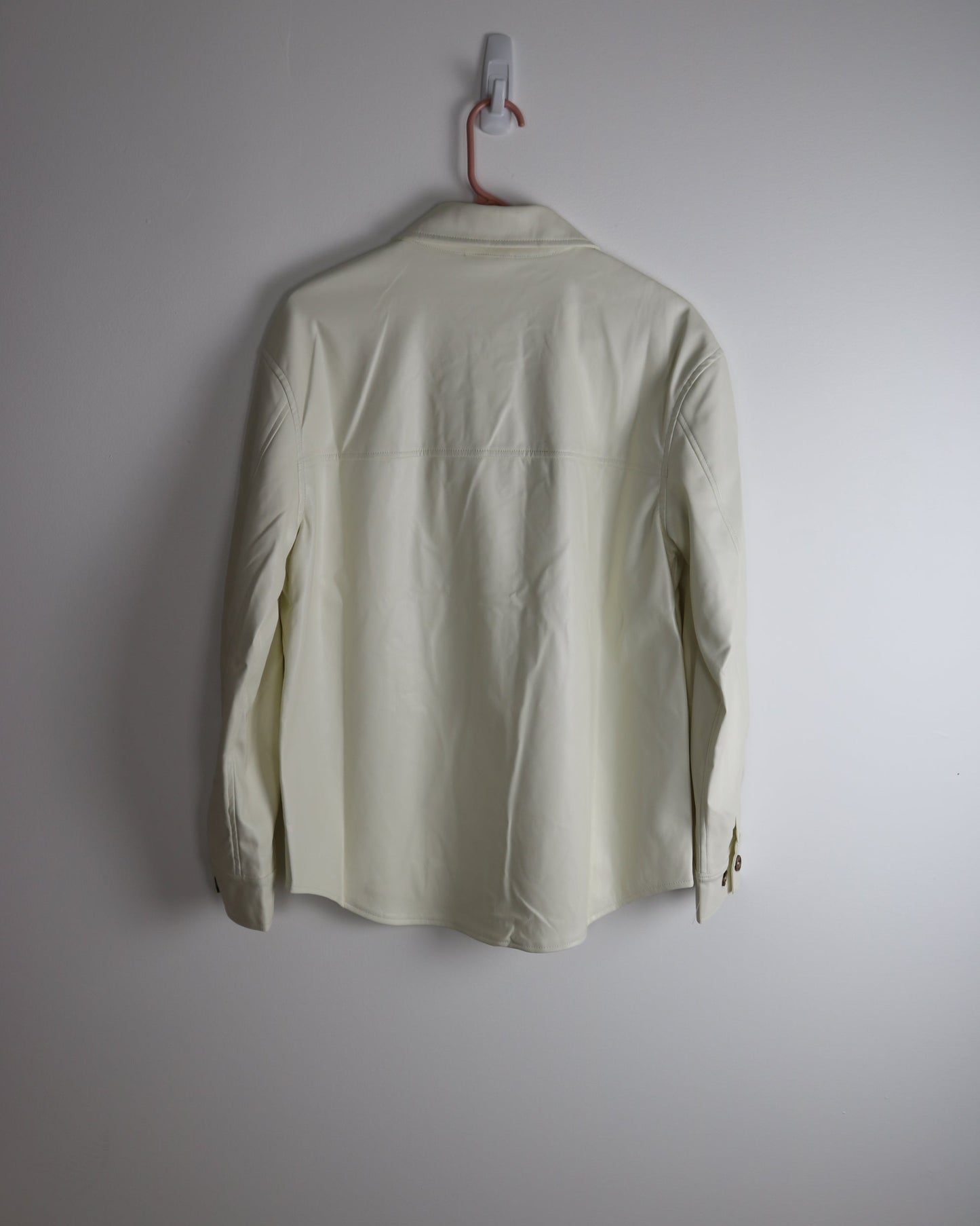 ivory vegan leather shacket hanging