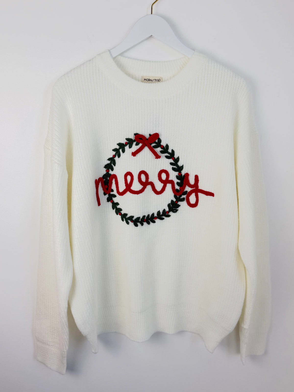 Ivory Merry Wreath Christmas sweater with green embroidered wreath and red bow
