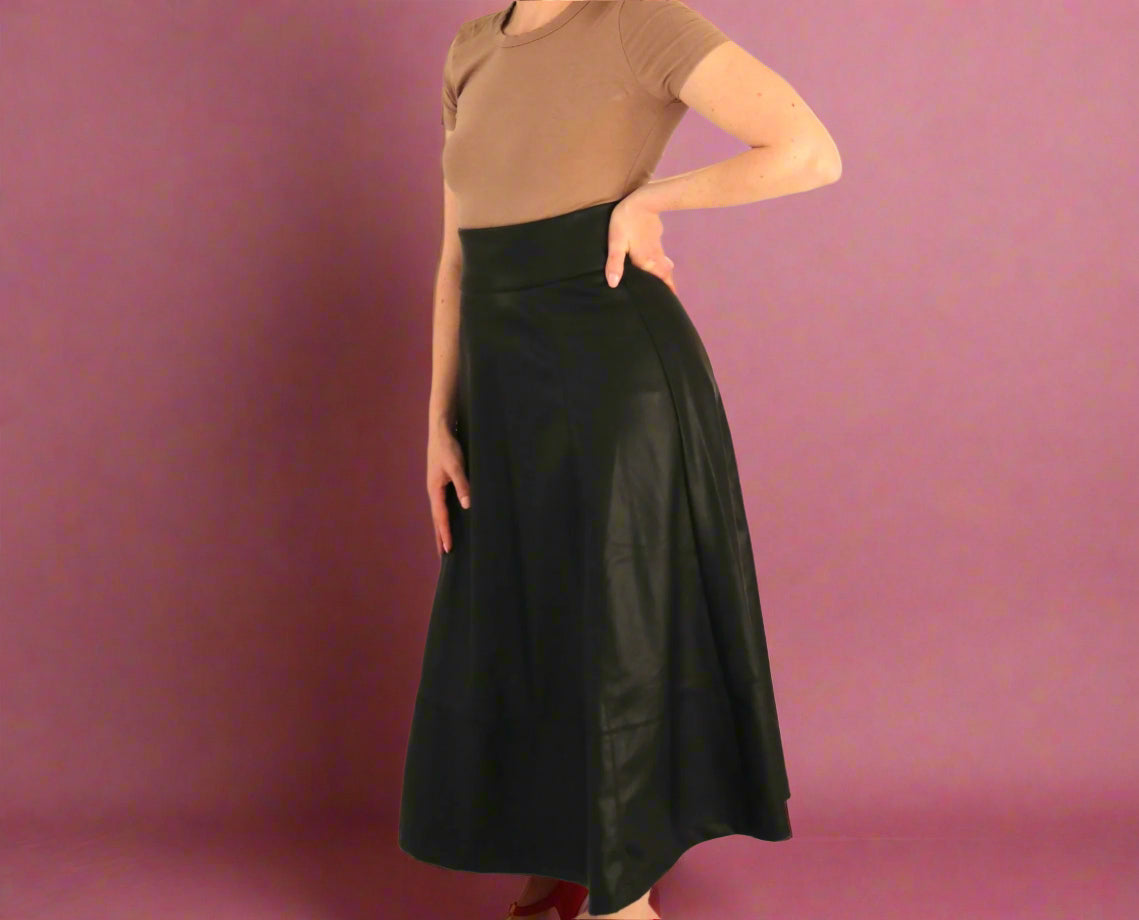 woman with brown tee and black leather skirt