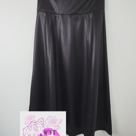 video of details of a black faux leather skirt