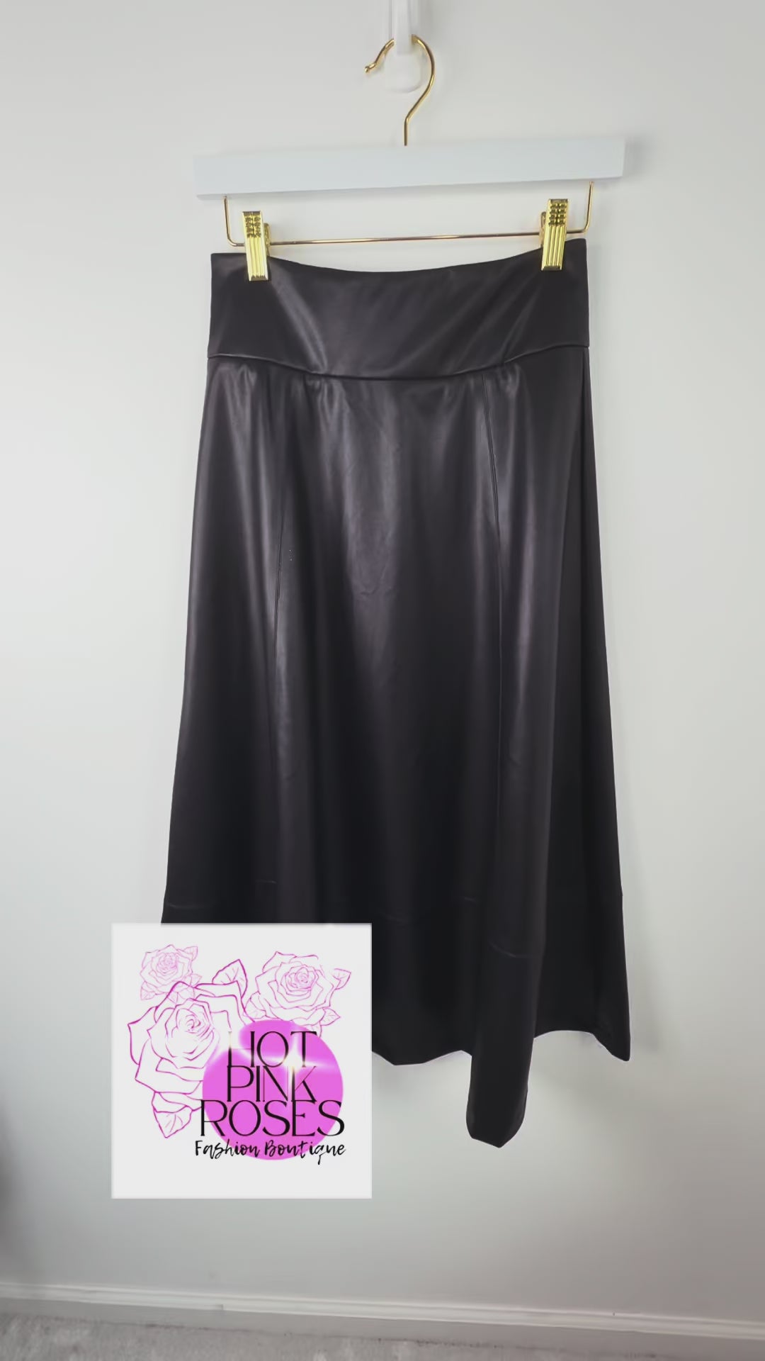 video of details of a black faux leather skirt