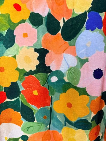 Colorful floral pattern with various flowers and leaves.